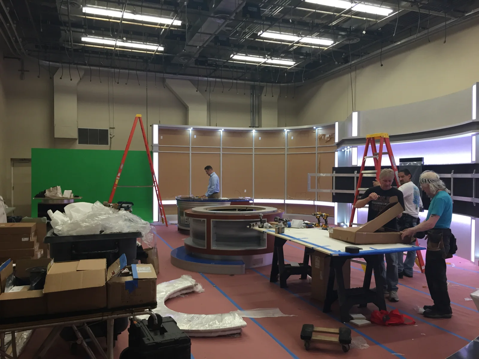 Installation work around the curved desk and rear wall