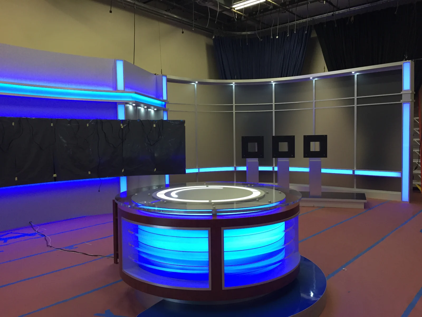 Desk lighting and blue scenic accents during setup