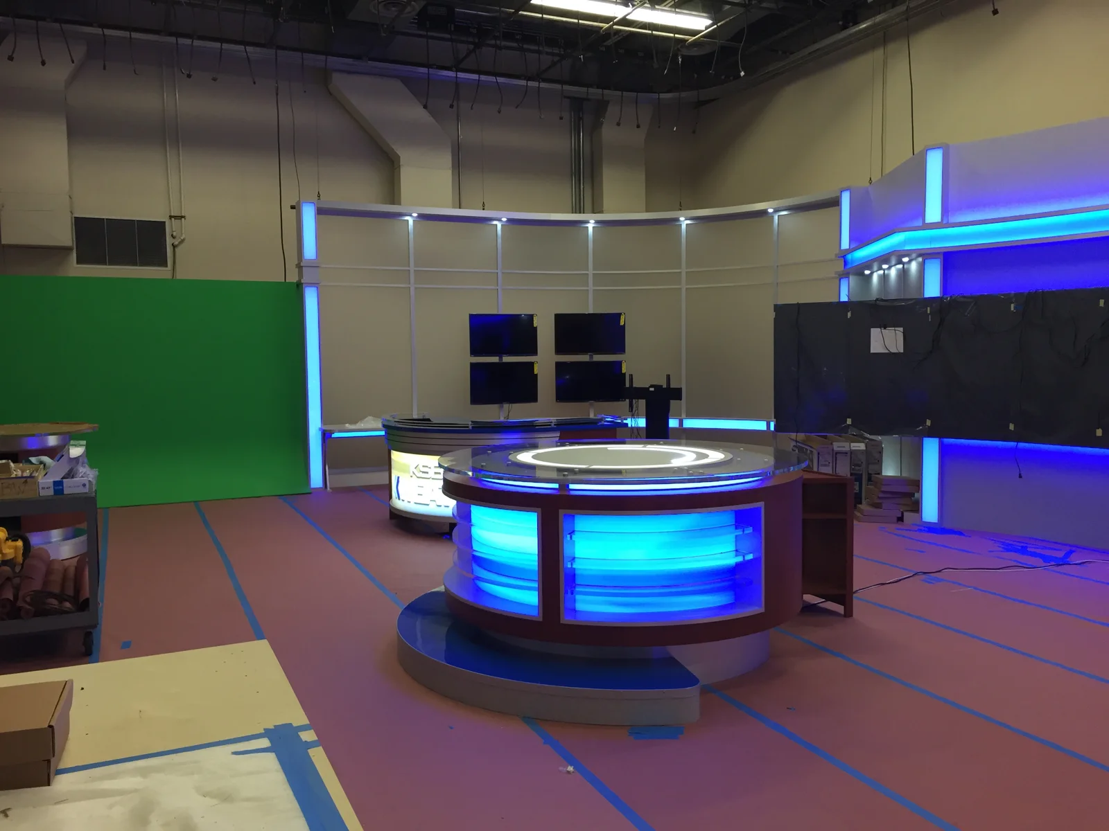 Illuminated desk and wall displays before floor completion