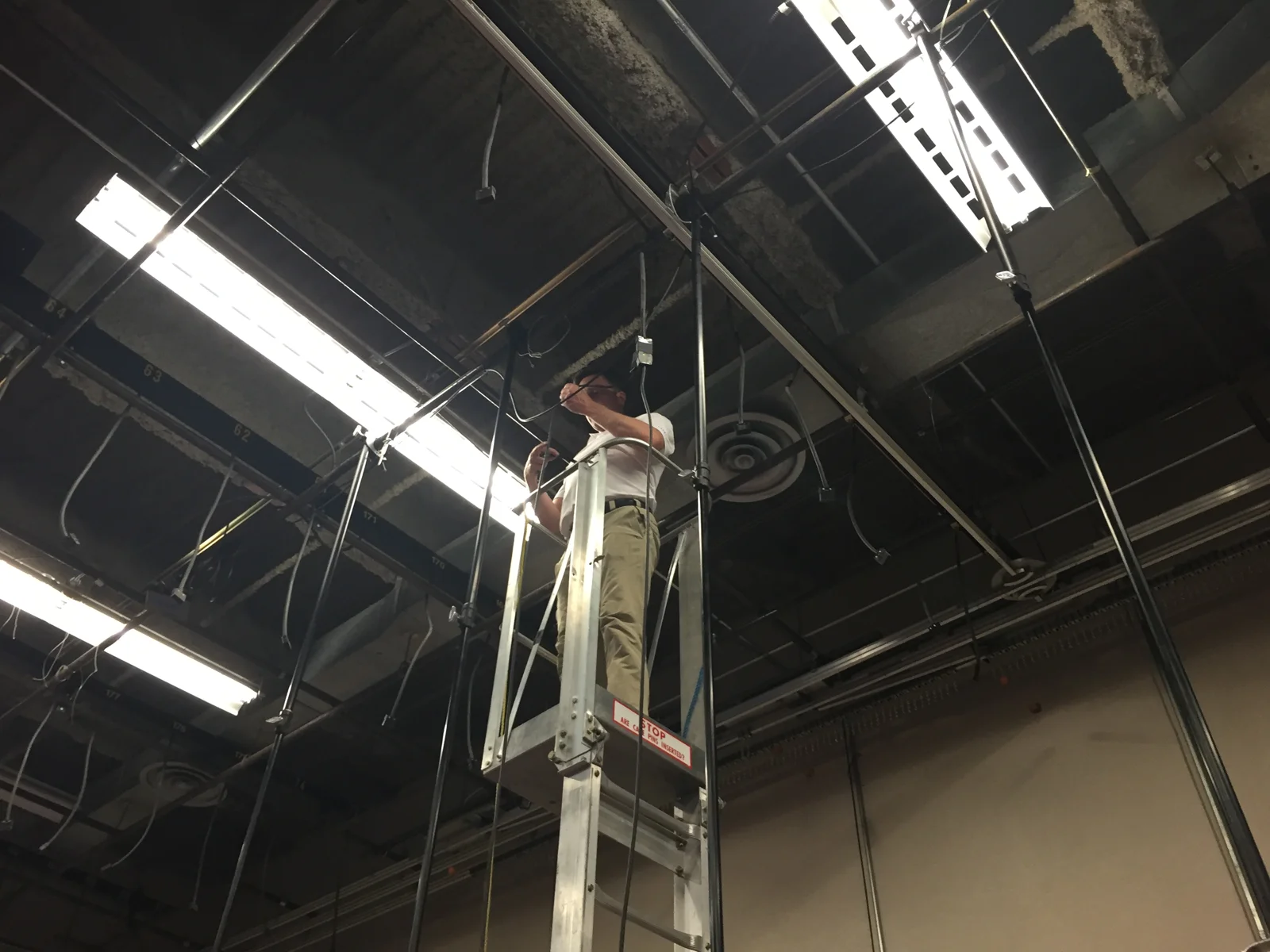 Overhead lighting work from a lift